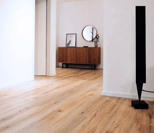 Room with a lighter-coloured timber floor staining