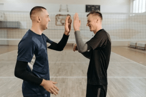 Line marking Melbourne: Sports players high fiving on court.