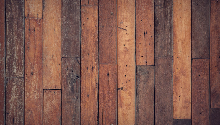 Worn natural timber floorboards representing sustainable flooring restoration in a Melbourne home