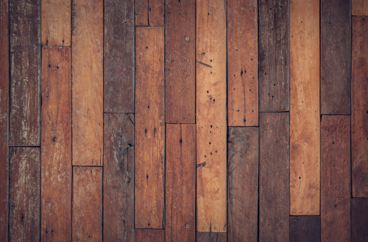 Worn natural timber floorboards representing sustainable flooring restoration in a Melbourne home