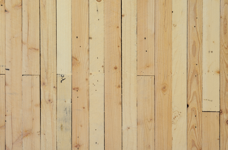 Unfinished tongue and groove flooring boards showing tight timber joints.